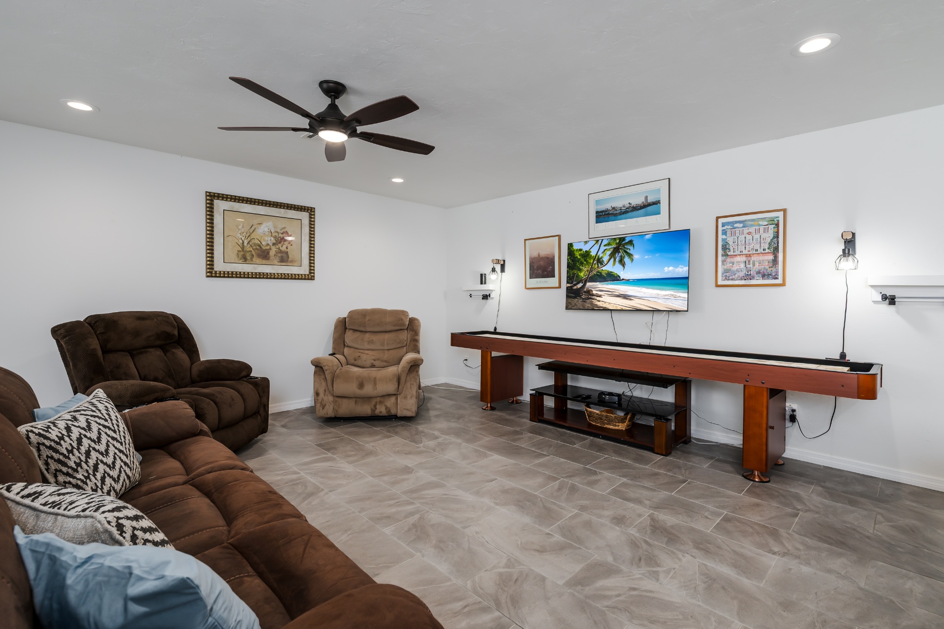Media lounge with shuffleboard and comfortable seating