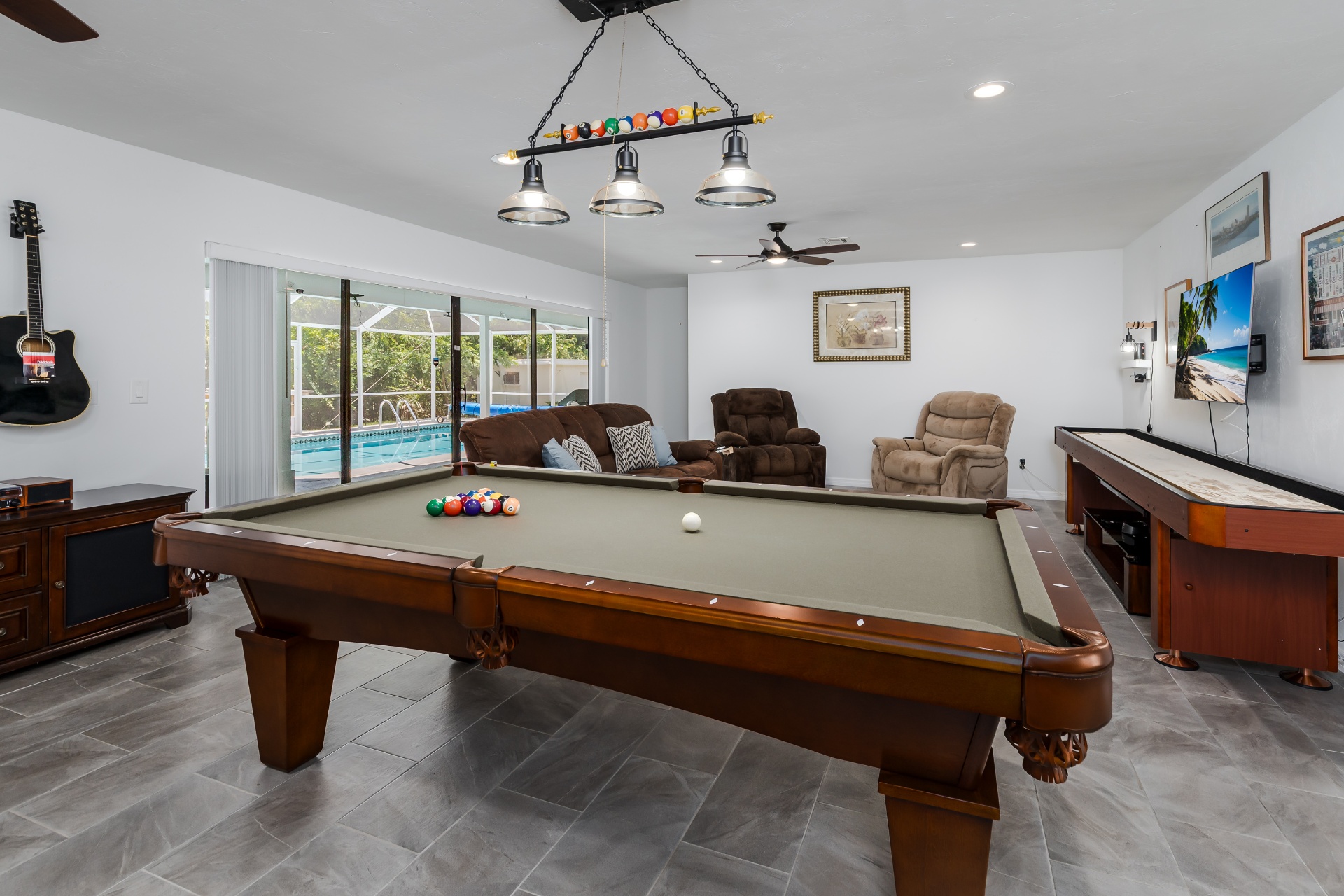 Pool table and shuffleboard in the recreation room